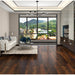 NAF AquaPlus Platinum Leo 9mm waterproof rigid core vinyl plank flooring with realistic wood grain and deep-textured finish in a living room