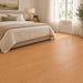 NAF AquaPlus Select Bracebridge 7mm waterproof rigid core vinyl plank flooring with realistic wood grain and deep-textured finish in a bedroom