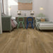 NAF AquaPlus Select Deerhurst 7mm waterproof rigid core vinyl plank flooring with realistic wood grain and deep-textured finish in a bedroom