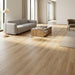 NAF AquaPlus Select Sauble Beach 7mm waterproof rigid core vinyl plank flooring with realistic wood grain and deep-textured finish applied in a living room