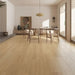 NAF Ariel 12mm waterproof laminate flooring featuring wide 9.3-inch wood-look planks and realistic 4D texture in a dining room