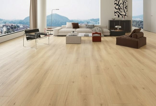 NAF Astra 12mm waterproof laminate PLUS flooring with wide 9.3-inch wood-look planks and realistic 4D surface texture in a living room