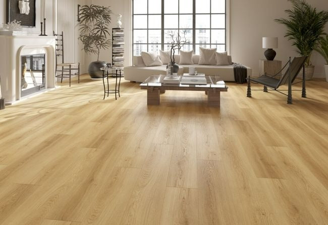 NAF Aurora 12mm waterproof laminate PLUS flooring featuring 9.3-inch-wide planks with detailed 4D wood-grain texture in a living room