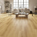 NAF Aurora 12mm waterproof laminate PLUS flooring featuring 9.3-inch-wide planks with detailed 4D wood-grain texture in a living room