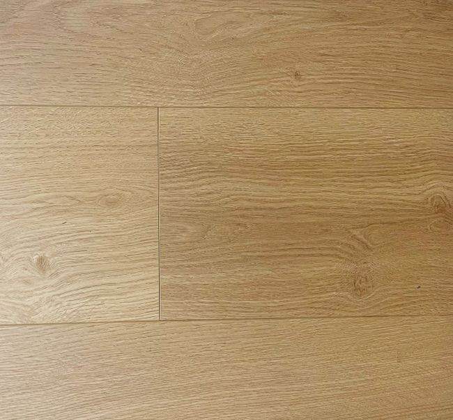 NAF Aurora 12mm waterproof laminate PLUS flooring featuring 9.3-inch-wide planks with detailed 4D wood-grain texture