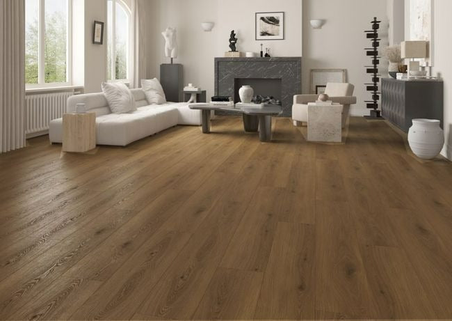 NAF Bianca 12mm waterproof laminate PLUS flooring with realistic 4D wood texture and wide 9.3-inch laminate planks in a living room