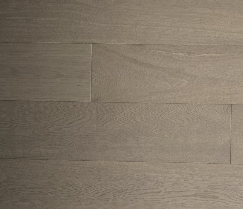 NAF Biscotti White Oak engineered hardwood flooring with 7.5-inch wide planks, natural oak grain patterns, and a textured wirebrushed surface