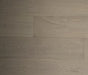 NAF Biscotti White Oak engineered hardwood flooring with 7.5-inch wide planks, natural oak grain patterns, and a textured wirebrushed surface