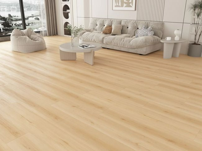 NAF Estella 12mm waterproof laminate PLUS flooring featuring realistic 4D wood texture and 9.3-inch-wide planks in a living room