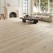 NAF Luna 12mm waterproof laminate PLUS flooring featuring 9.3-inch-wide wood-look planks with realistic 4D texture in a living room