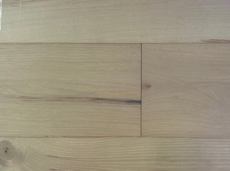 NAF Macadamia Hickory engineered hardwood flooring with 7.5-inch wide planks, natural wood grain and a wirebrushed surface