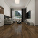 NAF Ravenwood 14mm waterproof laminate flooring featuring 7.7-inch wood-look planks with a realistic 4D textured finish in a living room