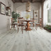 NAF Royal Windsor 8mm waterproof rigid core vinyl plank flooring with realistic wood grain and deep-textured finish in a dining room