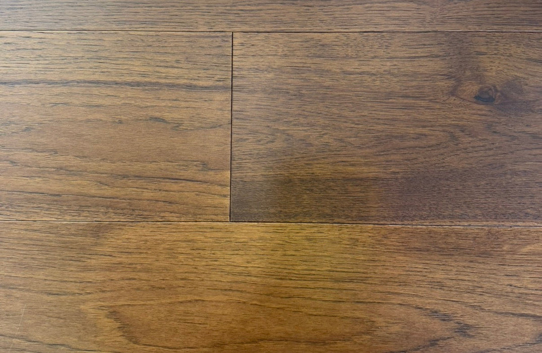NAF Saddle Brown Hickory engineered hardwood flooring with 7.5-inch wide planks, natural wood grain and a wirebrushed surface