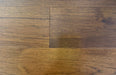 NAF Saddle Brown Hickory engineered hardwood flooring with 7.5-inch wide planks, natural wood grain and a wirebrushed surface