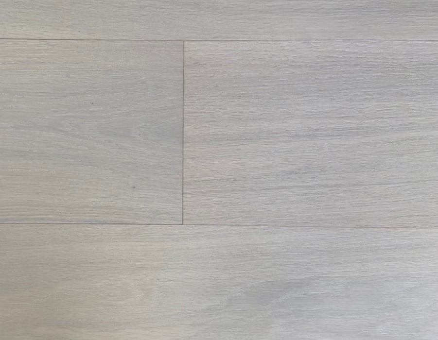 NAF Warm Honey European White Oak engineered hardwood flooring featuring 7.5-inch planks with natural grain and a wirebrushed surface